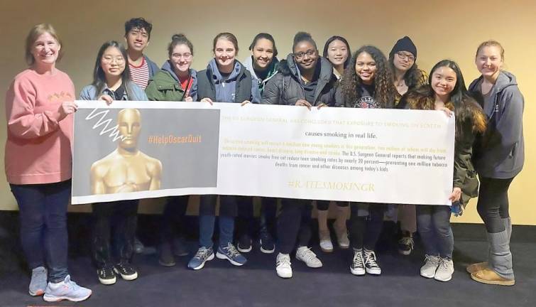 embers of John S. Burke Catholic High School’s Reality Check club raising awareness of the impact of smoking in films.