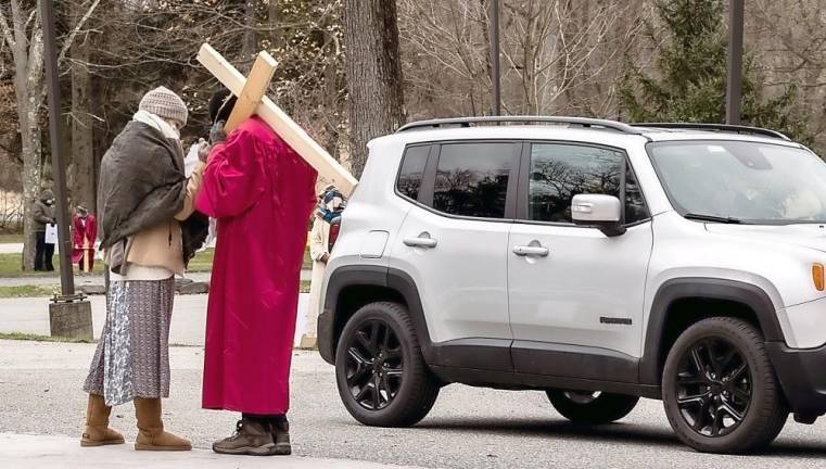 On this past Good Friday, 14 families, members of the Church of St. Stephen, the First Martyr, volunteered to dress in First Century AD-style costumes to pose in a live Stations of the Cross in the St. Stephen Parish parking lot. Photo provided by Mary Ellen Kerr.