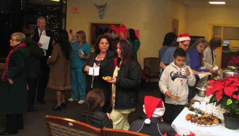 Everyone was invited indoors to enjoy a reception and refreshments featuring cookies, hot chocolate and apple cider.