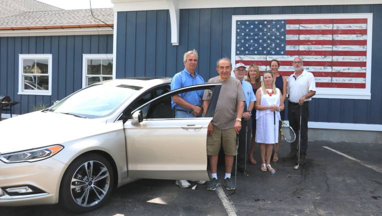 Pictured with the 2017 Ford Fusion are, from left, Leo R. Kaytes, Leo Kaytes Sr., Doug Stage, Jessica Cardella, Barbara Sullivan, Jane Brief and Frank Petrucci.