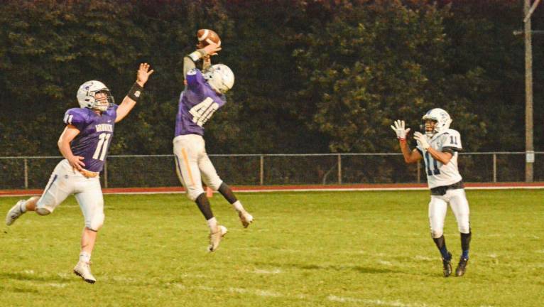 Photo by Al Konikowski Warwick senior defensive back Matt Houlihan intercepts a pass against the Middletown Bears at C. A. Morgan Field in the team's opening game of the 2018 season on Aug. 31. Warwick prevailed 21-18. Matt Hansen (#11) assists in coverage.