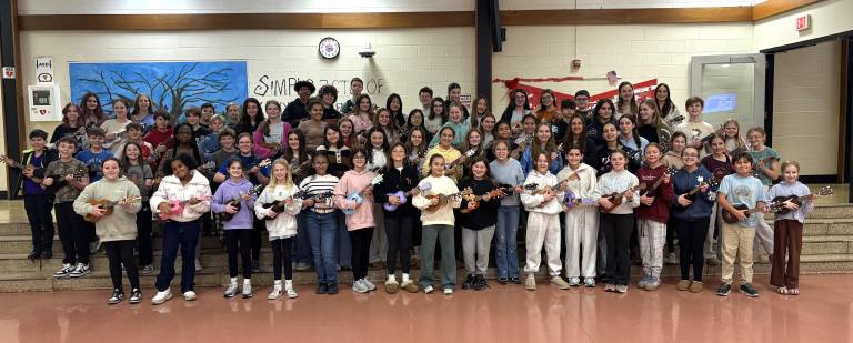 WVMS Ukulele Club students pose with their instruments.