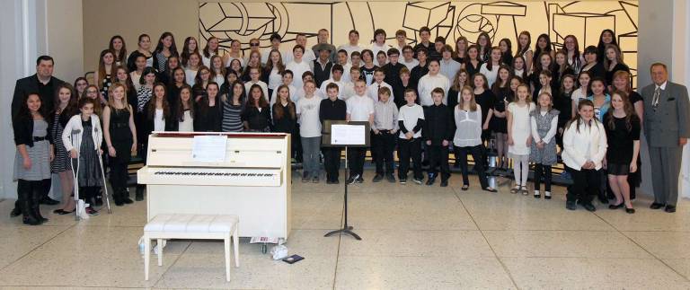 Photo credit: The New York State Senate) State Sen. John Bonacic, far right, appears with members of the Greenwood Lake Middle School 6th to 8th grade chorus during the young musicians' recent visit to the state capitol in Albany to celebrate &#xfe;&#xc4;&#xfa;Music in the Schools&#xfe;&#xc4;&#xf9; Month. Also appearing with the state senator and the students are Andrew Reith, the pianist for the chorus, and Chorus Director Laura Kroll.