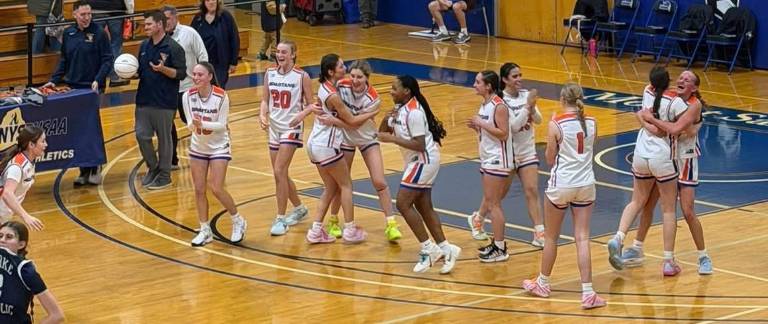 Spartan Girls Varsity Basketball team celebrates their clinching of the Section 9 Class C championship.