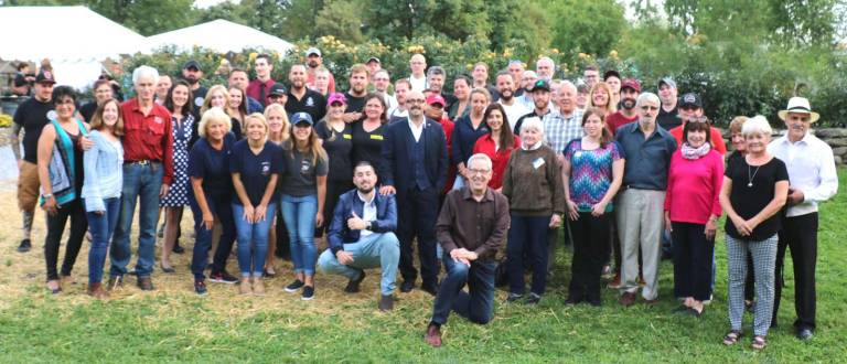 The vendors, chefs and staff pose with members of the Warwick Valley Chamber of Commerce.