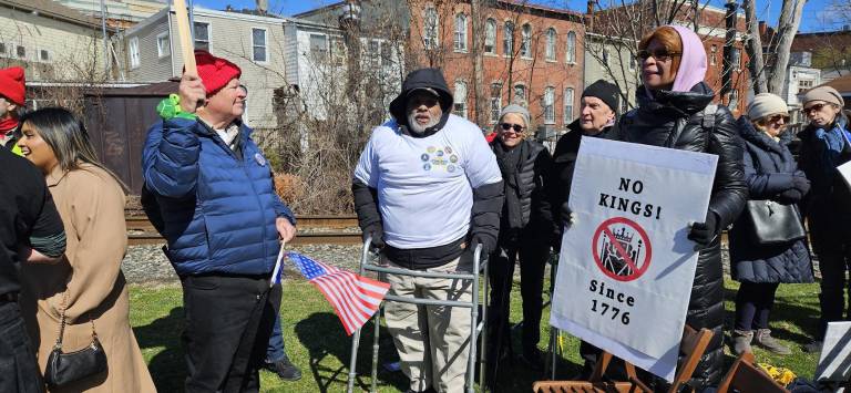 Veterans advocate Manny Tirado (center).