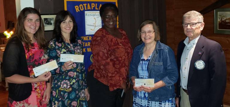 Rotarians donate to four non-profit groups