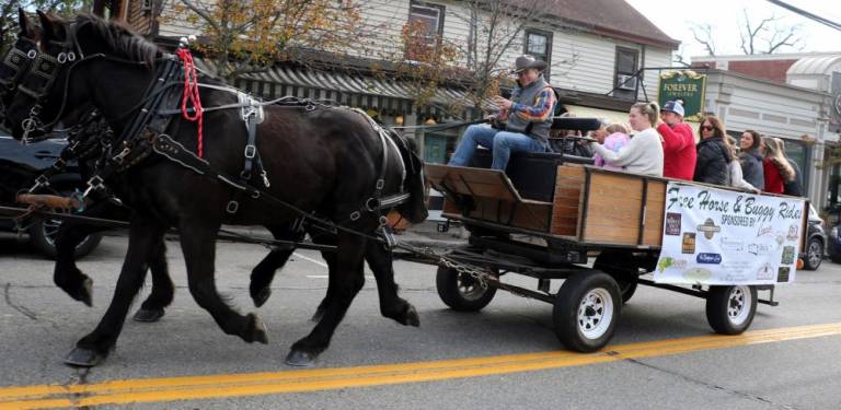 Sean Giery and his team of Percherons, Billy and Bobby, returned to give free horse and buggy rides through the Village. Photos by Roger Gavan.
