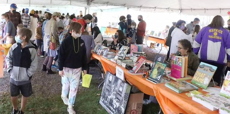 After being canceled last year due to the pandemic, the ninth Children’s Book Festival, held that day in Stanley-Deming Park, drew huge crowds but all were required to wear masks..