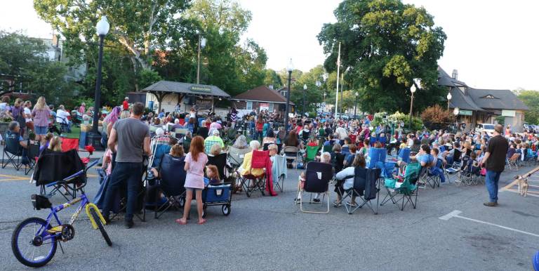 [On Wednesday evening, July 24, an audience, estimated to be well over 600 fans, filled Railroad Green and the adjacent street and sidewalk area]
