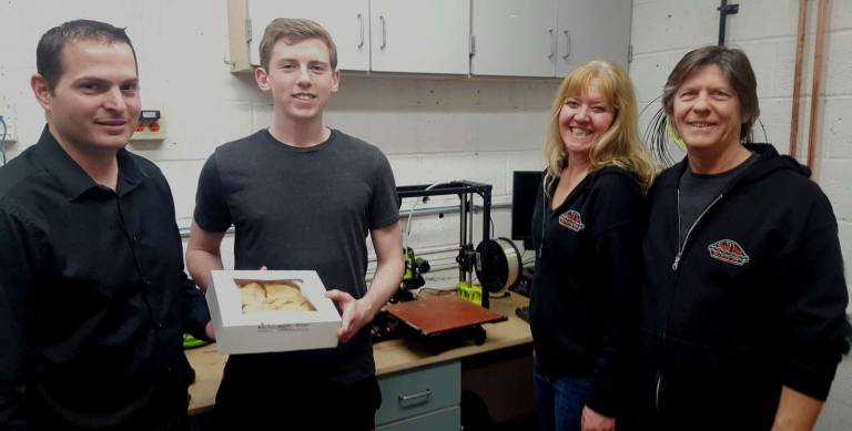 Pictured from left to right are Warwick Valley High School teacher Michael Stolt, student Anthony Gray and owners of Noble Pies.