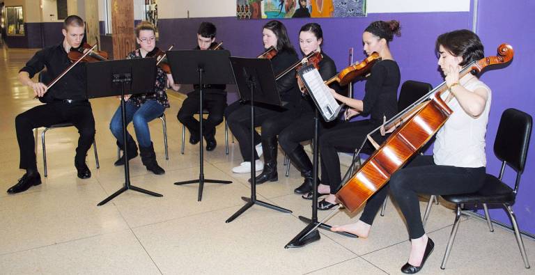 The Warwick Valley School District has been recognized for its commitment to music education with a national &#xfe;&#xc4;&#xfa;Best Communities for Music Education&#xfe;&#xc4;&#xf9; designation. Pictured here are musicians who volunteered to provide music at the high school&#xfe;&#xc4;&#xf4;s recent Empty Bowls fund raiser. There are more than 700 students from grades four through twelve who participate in band or orchestra activities.