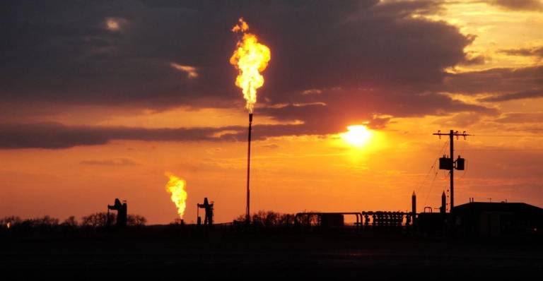 Methane flares at natural gas wells.