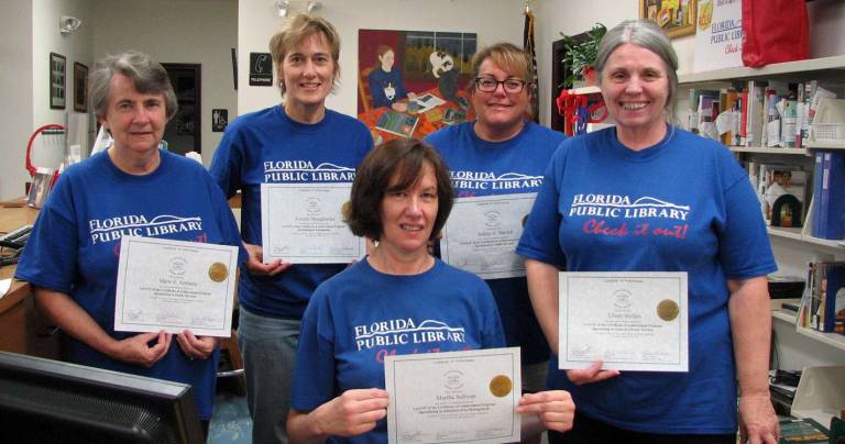 Five staff members of the Florida Public Library have been awarded Certificates of Achievement at the highest level by the New York State Library Assistants&#xed; Association and the New York Library Association. The staff members are Martha Sullivan, seated in front; and standing from left to right: Marie Arnstein, Annette Shaughnessy, Ashley Baroch and Eileen Stelljes.