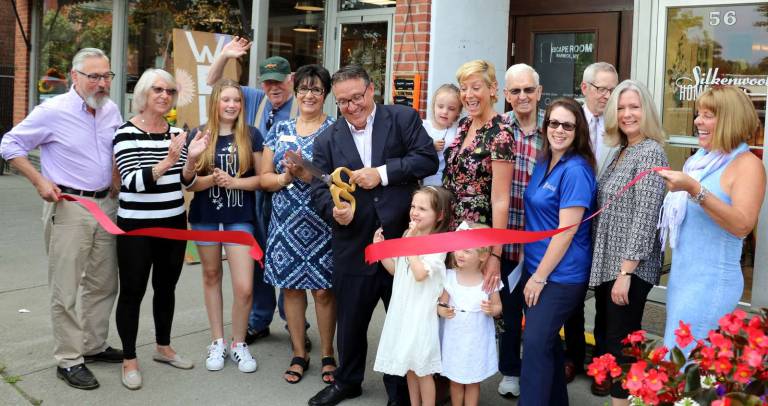 Photo by Roger Gavan On Friday, Aug. 11, Village of Warwick Mayor Michael Newhard (left) and members of the Warwick Valley Chamber of Commerce joined business partner Michael Metzger (center), his wife Kerry and their three children, Maggie, 6, twins Gracie and Sadie, 3, along with other members of their family to celebrate the grand opening of Escape Room Warwick.