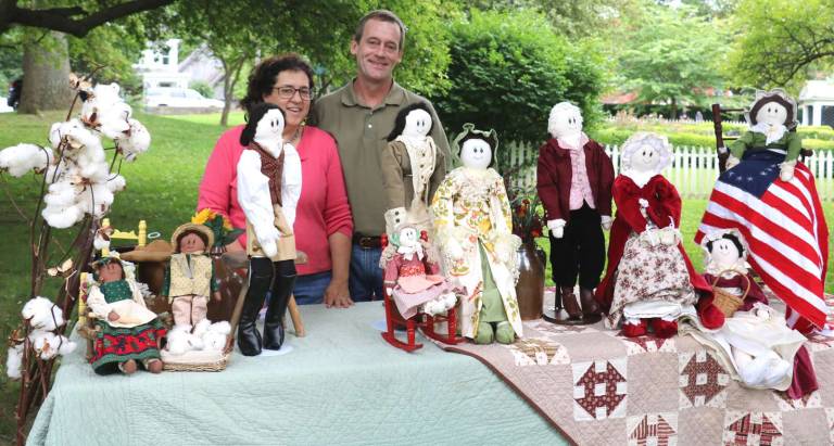 Craft exhibits at the community celebration included hand made custom dolls by Naomi Bush pictured with her husband Josh Bush. To order a doll Naomi Bush can be contacted at 386-8797