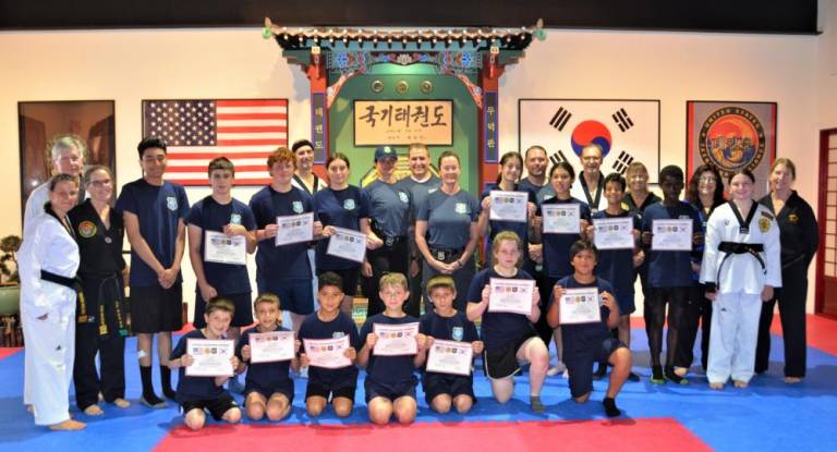 Fifteen members of the Warwick Junior Police Academy participated in a special self-defense course at the Chosun Taekwondo Academy earlier this month. Provided photos.