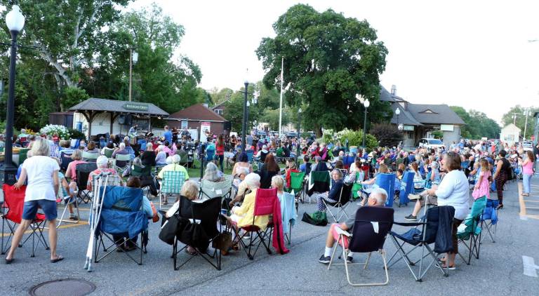[On Wednesday evening, July 24, an audience, estimated to be well over 600 fans, filled Railroad Green and the adjacent street and sidewalk area]