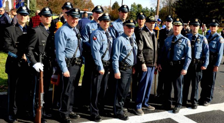 Perhaps the oldest World War II veteran present at the event, Warren C. Mc Farland, 97, also served as the Village of Warwick Police Chief until his retirement in 1978. Following the Veterans Day ceremonies he posed (center) for photos with Chief Thomas McGovern (right), Lt. John Rader (left) and officers of the Warwick Police Department.