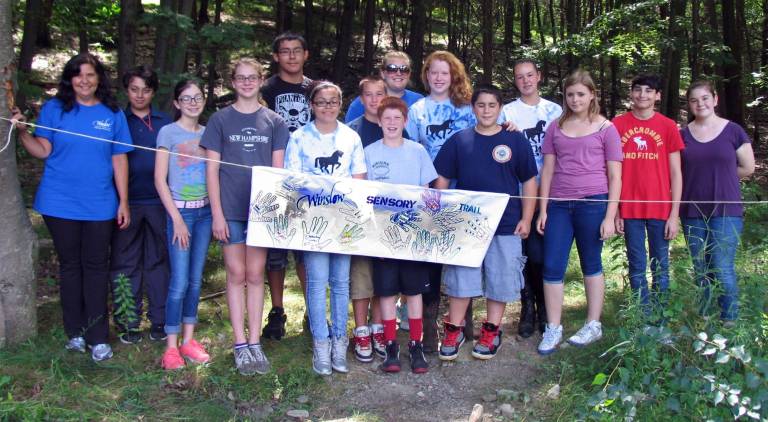 Photo by Roger Gavan Participants in Orange County&#xed;s Summer 2013 Youth Leadership Academy hosted by Winslow Therapeutic Center Celebrate the grand opening of a new sensory trail with a &#xec;rope cutting ceremony.&#xee; Front from left, Site Director Pam Heatley, participants Marcello Guidi, Jessica Decker, Sarah Decker, Jordyn Corter, Scott Wortmann, Lucas Triantis, Monika Krutka, Mark Coiro and Emma Meier. Rear from left, Sebastian Gaibur, Tim Curtis, Team Leader Shannon Wortmann, Danielle Cheney and Taylor Oslacky. Not available for the photograph: Jessica Miller and Joshua Salsa.