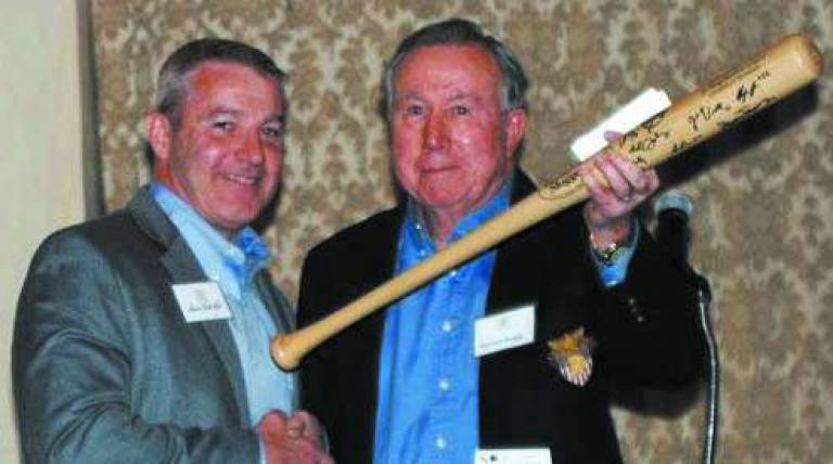 Col (Ret.) Barret Haight, right, (USMA 59&#xfe;&#xc4;&#xf4; grad and former Army baseball shortstop) accepts gift from Peter McCall, member of the Army Baseball Room Committee, at a ceremony at the Historic Thayer Hotel at West Point, March 30. The new Army Baseball Room is filled with Army baseball memorabilia and is one of many dedication rooms in the hotel&#xfe;&#xc4;&#xf4;s inventory which recognizes distinguished West Point graduates.