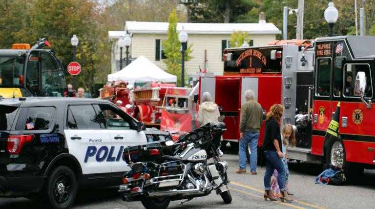 Photos by Roger Gavan A visitor to the Village of Warwick on Saturday, Oct. 14, might have understandably assumed that police, fire apparatus and personnel had just responded to a serious emergency on Railroad Avenue. But he or she would soon discover that this was just &#x201c;First Responders Day,&#x201d; sponsored by the Village Sesquicentennial Committee to honor the Warwick Fire Department, the Warwick Emergency Medical Service, the Warwick Police Department and the Village of Warwick Department of Public Works.
