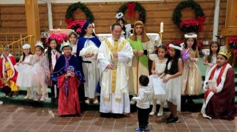 The children of the Bilingual Family Faith Formation classes dressed as the holy family, kings, angels and shepherds. The Rev. Reynor Santiago gave them all a very special blessing. Photo by Rocco Battista.