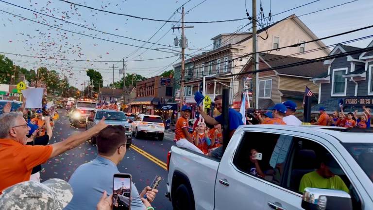 Fans line the streets in downtown Florida to salute their hometown heroes after their Little League all-stars won the NYS Section 3 championship Monday, July 20.