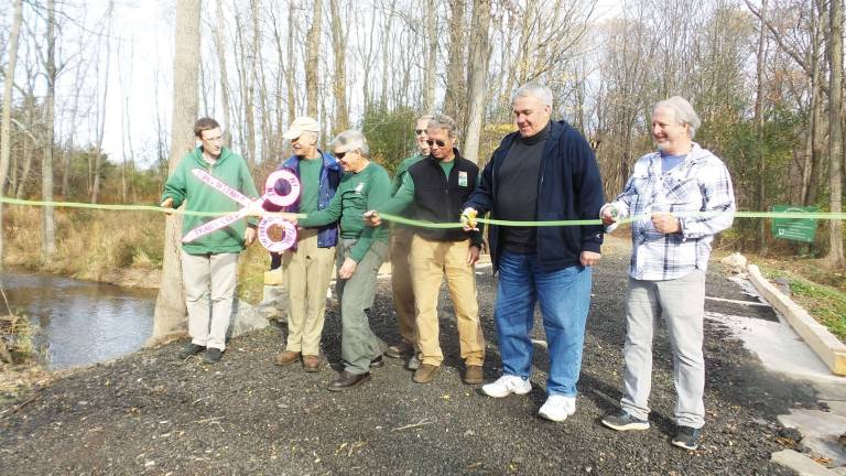 The ribbon cutting at the newly restored bridge (Photo by Frances Ruth Harris)