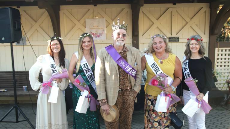 Tim Mullaly, 2026 Queen for a Day, surrounded by members of the royal court.