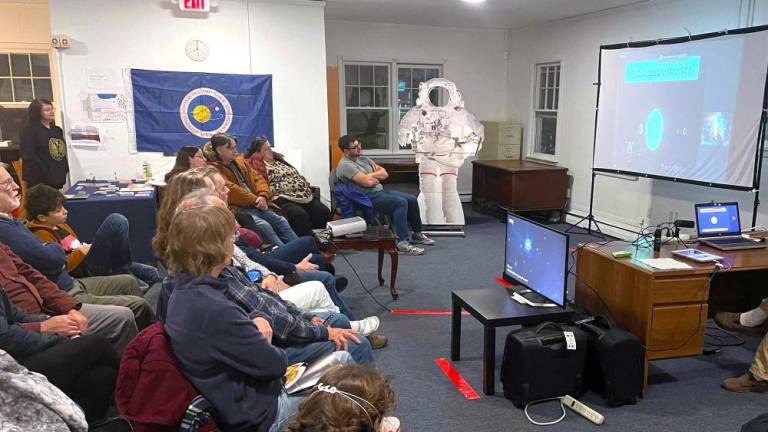 The crowd listened intently to the discussion.
