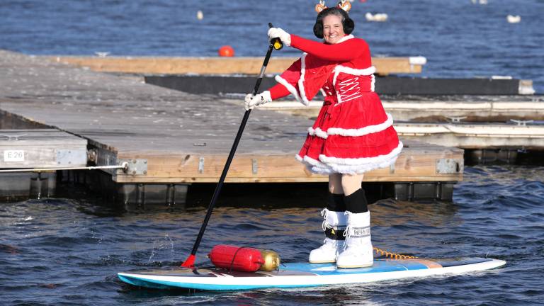 Micki Michelle on the lake during the 12th Annual Greenwood Lake Santa Palooza Paddle. - to raise money and collect food for the local pantries. Organized by Micki Michelle and Dee Schmitz - Jersey Paddle Boards
