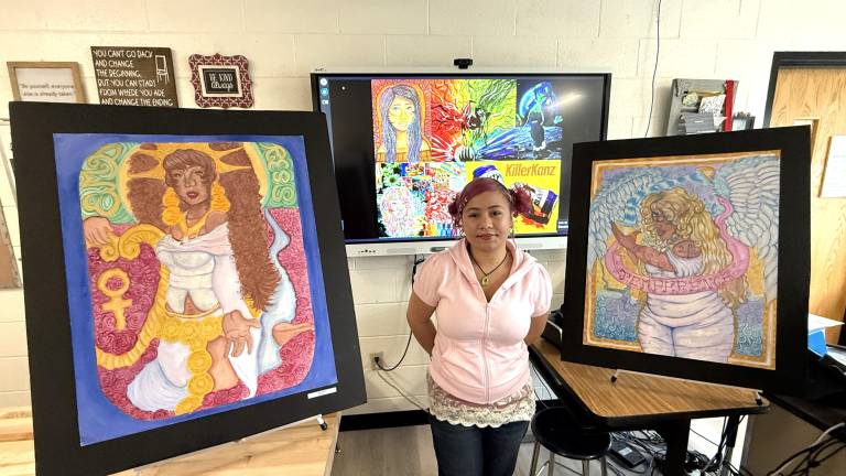 WVHS Senior Jaida Martinez poses with her artwork.