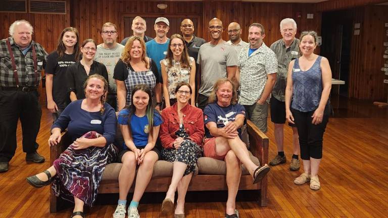 Front row: Hanne Chambers, Sprite Fallon, Carly Foster, and Jim Hall. Middle: Lea Fallon, Kat Leo, Christine Leo, Tim Gamory, Pasquale Leo, and Rekha Shoenfeld-Woods. Back row: Martin Pirringer, Sean Fallon, Joe Morse, Paul Woods, William LeBar, Mark Harris, Sandeep Luke, and Grady Schenck.
