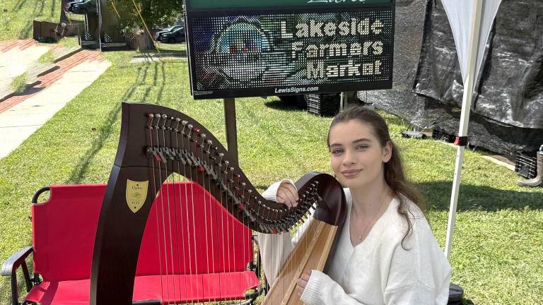 Catherine Mahoney and her Lyon &amp; Healy Ogden harp at the Lakeside Farmers Market.