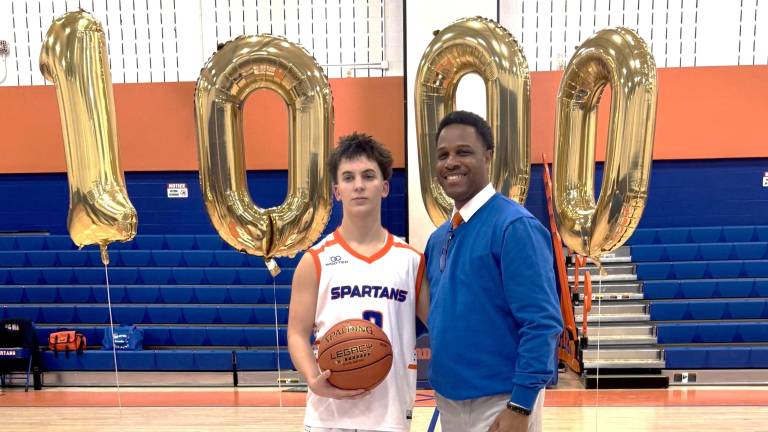 Seward sophomore Grey Whitmore and Coach Michael Washington.