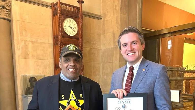 Manolin Tirado (left) with Sen. James Skoufis.