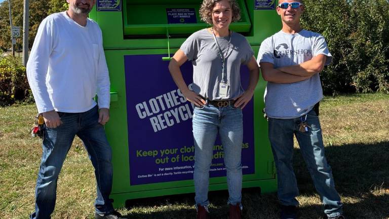 From left: Trevor Cochrane, chief operating officer of Clothes Bin LI Franchisee Operations; Straus News Deputy Publisher Becca Tucker; Robert Colucci, Clothes Bin LI operation specialist.