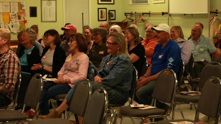 Crowd laughing at a recent Story Share event.