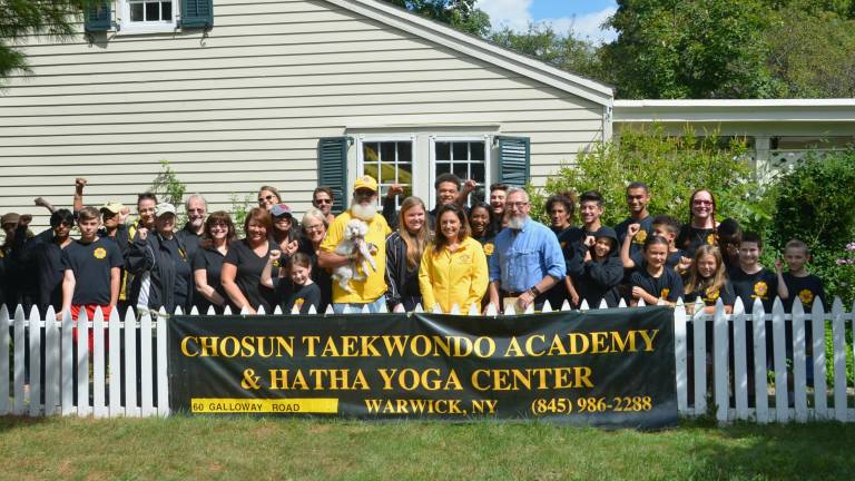 The Chosun Taekwondo Academy Leadership Team with Warwick Mayor Michael Newhard and Lions Club members. Photo provided