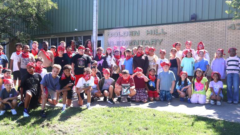 Students in the fifth grade at Golden Hill each received and wore their own red bandanas, in honor of Welles Crowther.